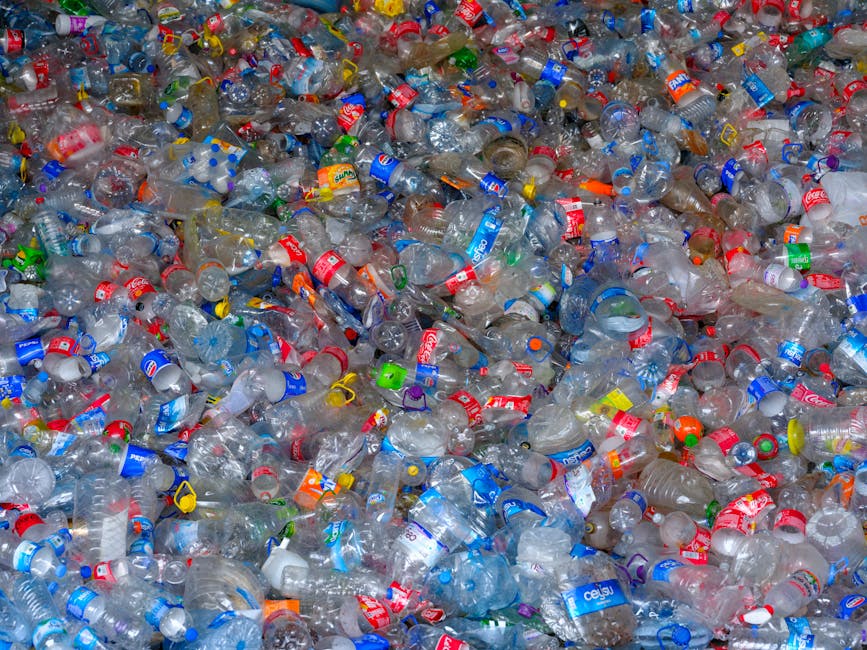 Pile of discarded plastic bottles at a recycling center