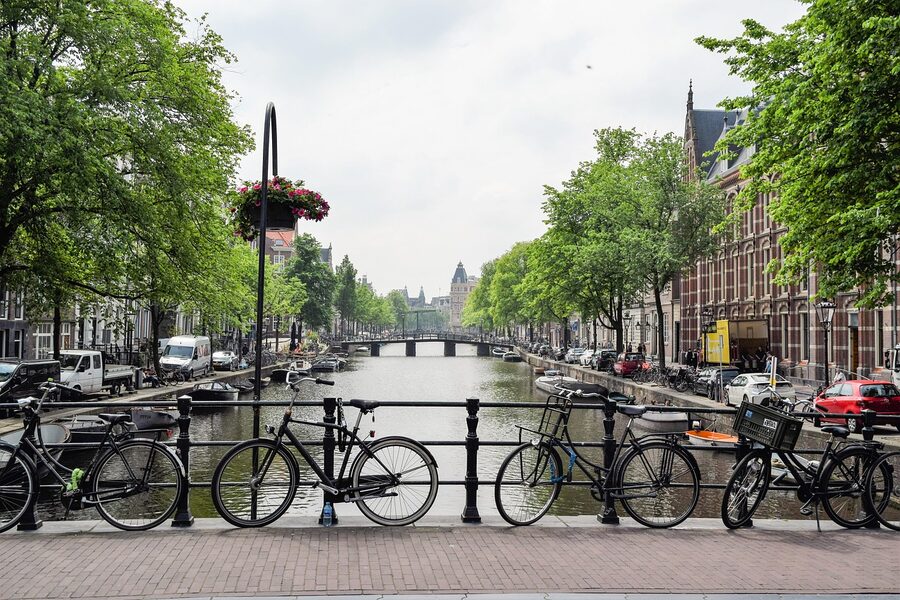 Bicycle next to an Amsterdam canal, a low-carbon way to move through a city