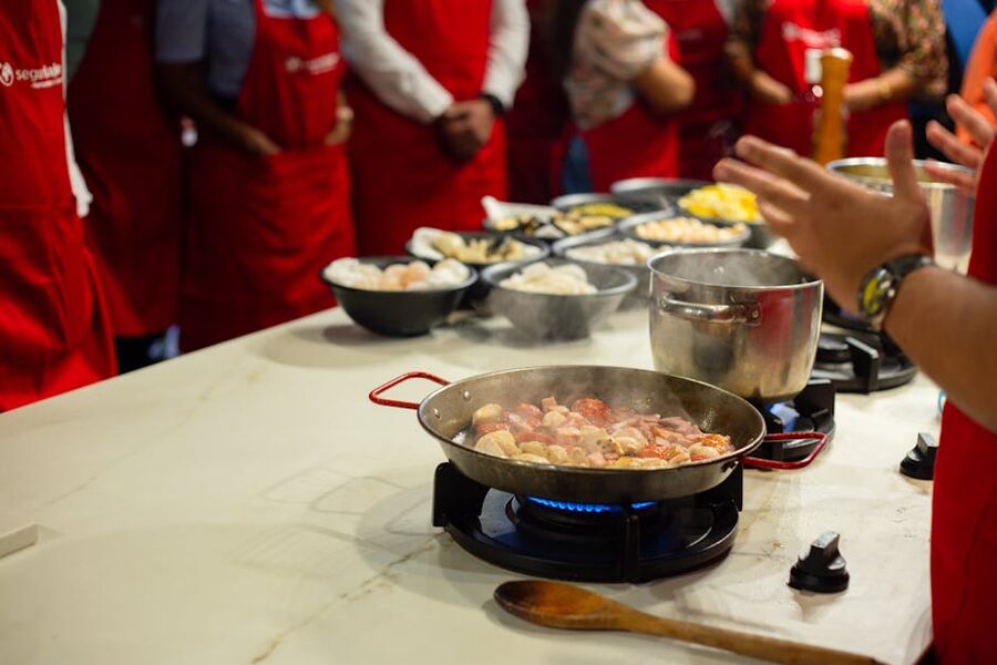 Hands-on cooking class with participants learning skills