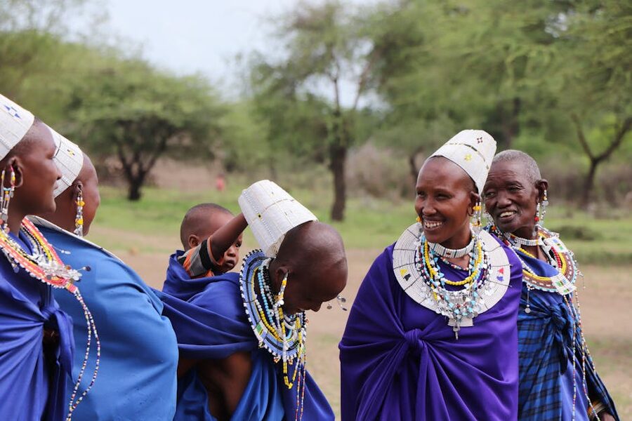 Maasai women and a child in traditional attire in Kenya