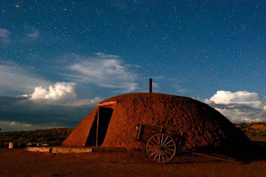 A traditional Navajo hogan in the desert at twilight