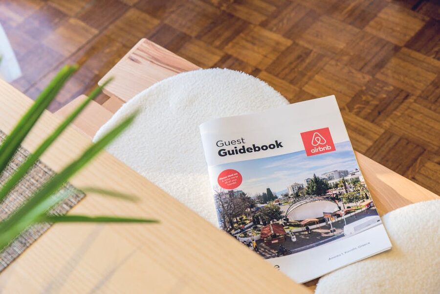 A travel guidebook lying open on a wooden table