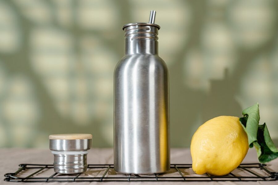 Reusable stainless steel water bottle with a lemon