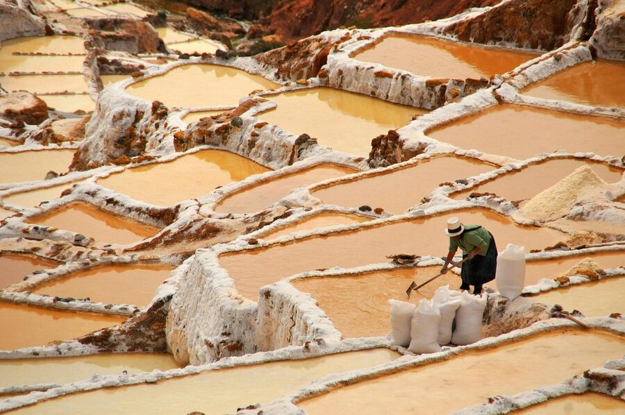 The Maras salt pans in the Sacred Valley, Peru, where centuries-old community salt-harvesting continues alongside tourism